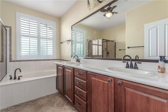 2489 Black River Falls Dr, Henderson, NV 89044 - full bathroom featuring double vanity, a sink, a garden tub, and a stall shower