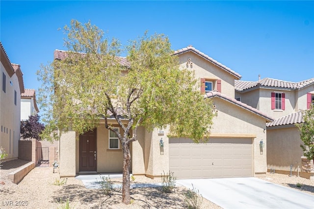 view of front of property featuring a tile roof, an attached garage, driveway, and stucco siding