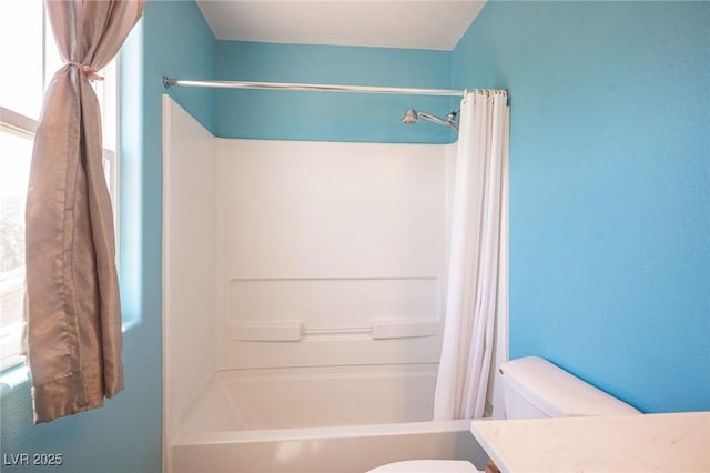 full bath featuring shower / bath combo, vanity, and toilet