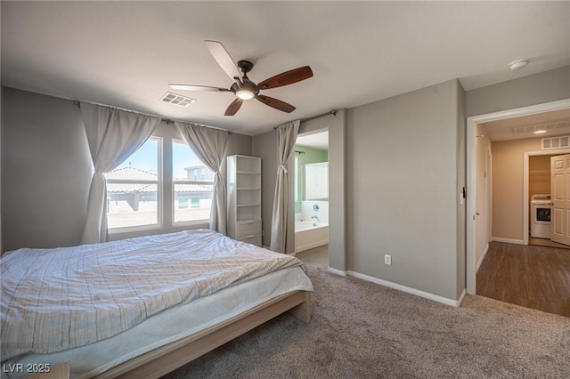 bedroom with baseboards, visible vents, carpet floors, and washer / dryer