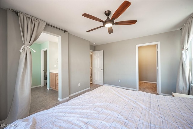 unfurnished bedroom with ensuite bath, a ceiling fan, and baseboards