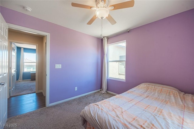 bedroom with carpet floors, a ceiling fan, and baseboards