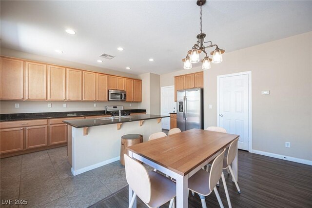 dining area with recessed lighting, an inviting chandelier, visible vents, baseboards, and dark tile patterned flooring