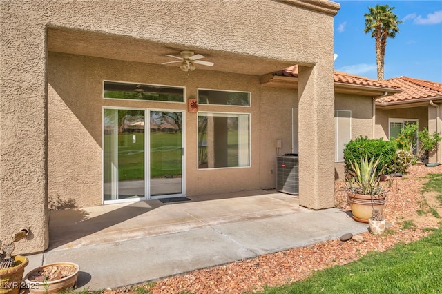 1074 Chaparral Dr, Mesquite, NV 89027 - view of exterior entry featuring ceiling fan, a patio, stucco siding, and a tile roof