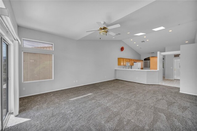 1074 Chaparral Dr, Mesquite, NV 89027 - unfurnished living room featuring light carpet, lofted ceiling, a ceiling fan, and recessed lighting