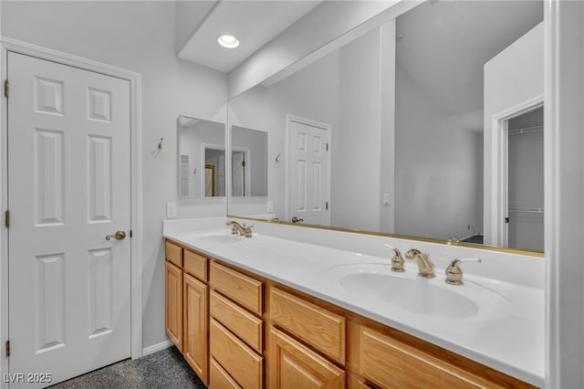 1074 Chaparral Dr, Mesquite, NV 89027 - bathroom featuring double vanity, vaulted ceiling, and recessed lighting