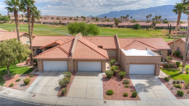 1074 Chaparral Dr, Mesquite, NV 89027 - view of front of home featuring stucco siding, a residential view, driveway, and a tiled roof