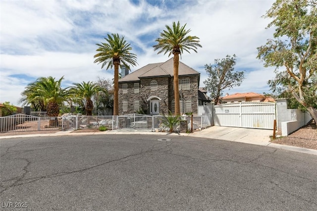 6520 Turtle Hill Rd, Las Vegas, NV 89110 - view of front of home with stone siding, fence, and a gate