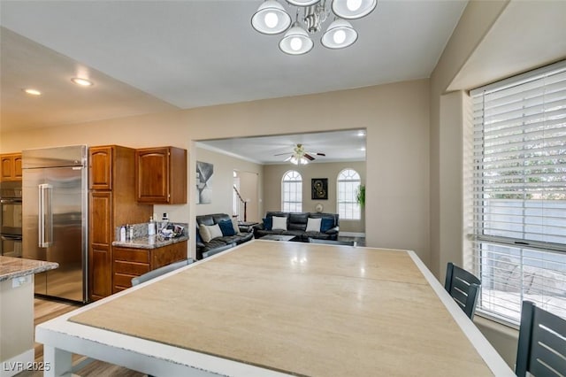 6520 Turtle Hill Rd, Las Vegas, NV 89110 - dining area featuring baseboards, recessed lighting, light wood finished floors, and ceiling fan with notable chandelier