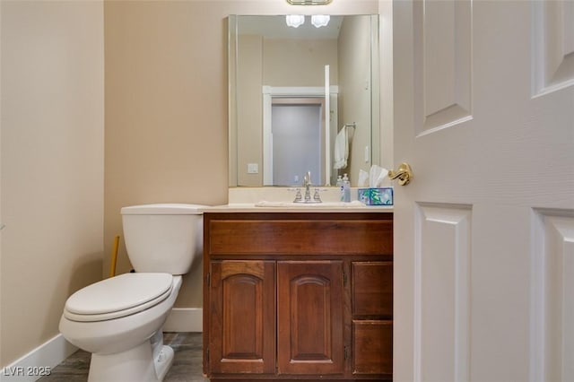 6520 Turtle Hill Rd, Las Vegas, NV 89110 - bathroom featuring wood finished floors, vanity, toilet, and baseboards