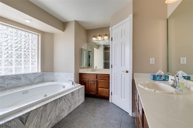 6520 Turtle Hill Rd, Las Vegas, NV 89110 - bathroom with a garden tub, two vanities, tile patterned flooring, and a sink