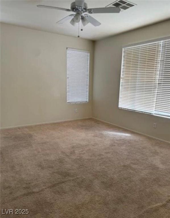 1003 Dover Glen Dr, North Las Vegas, NV 89031 - carpeted empty room with visible vents, baseboards, and ceiling fan