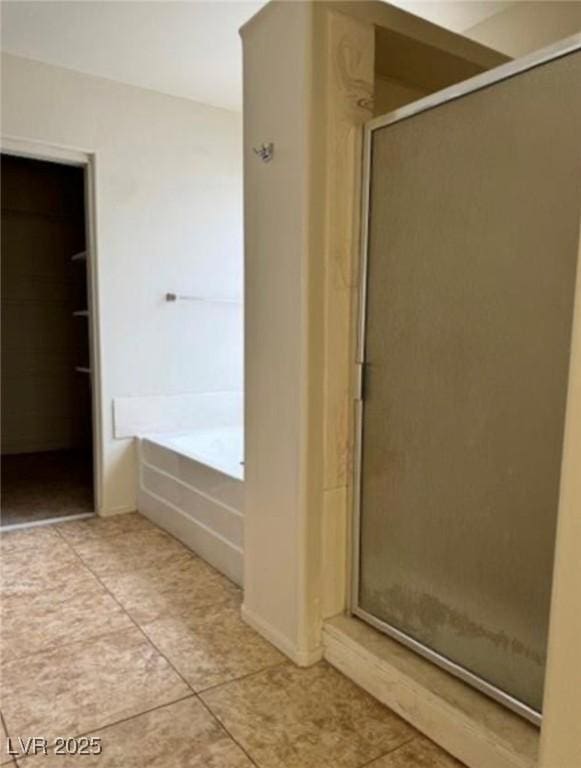 1003 Dover Glen Dr, North Las Vegas, NV 89031 - bathroom with a garden tub, tile patterned flooring, and a shower stall