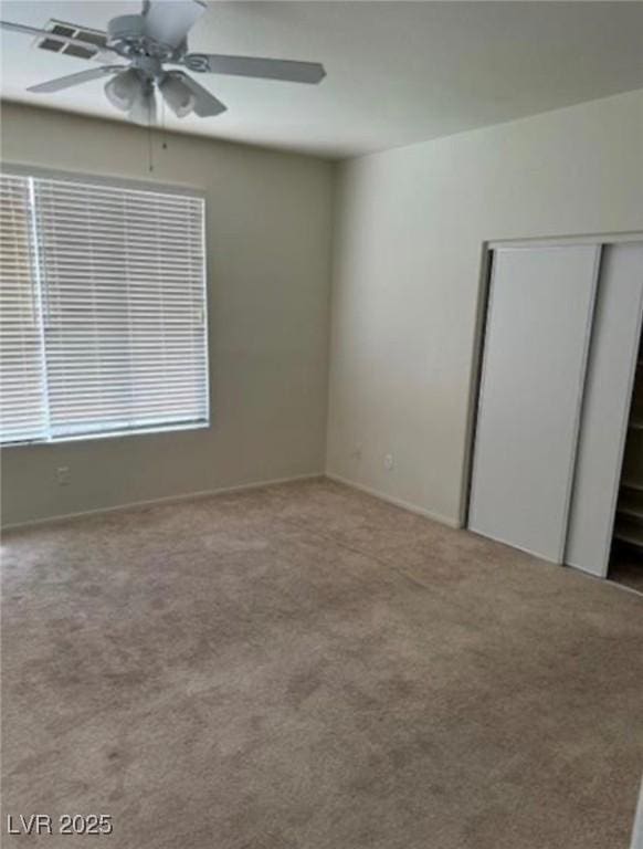 1003 Dover Glen Dr, North Las Vegas, NV 89031 - empty room featuring carpet floors, a ceiling fan, and baseboards