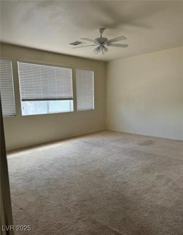 1003 Dover Glen Dr, North Las Vegas, NV 89031 - carpeted empty room with ceiling fan