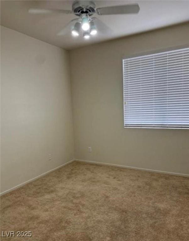 1003 Dover Glen Dr, North Las Vegas, NV 89031 - spare room featuring carpet flooring, baseboards, and a ceiling fan