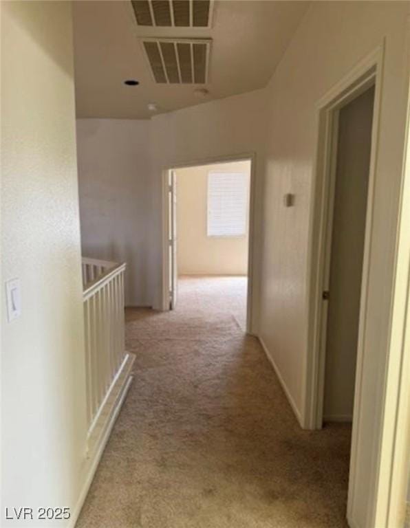 1003 Dover Glen Dr, North Las Vegas, NV 89031 - hall with visible vents, carpet flooring, and an upstairs landing