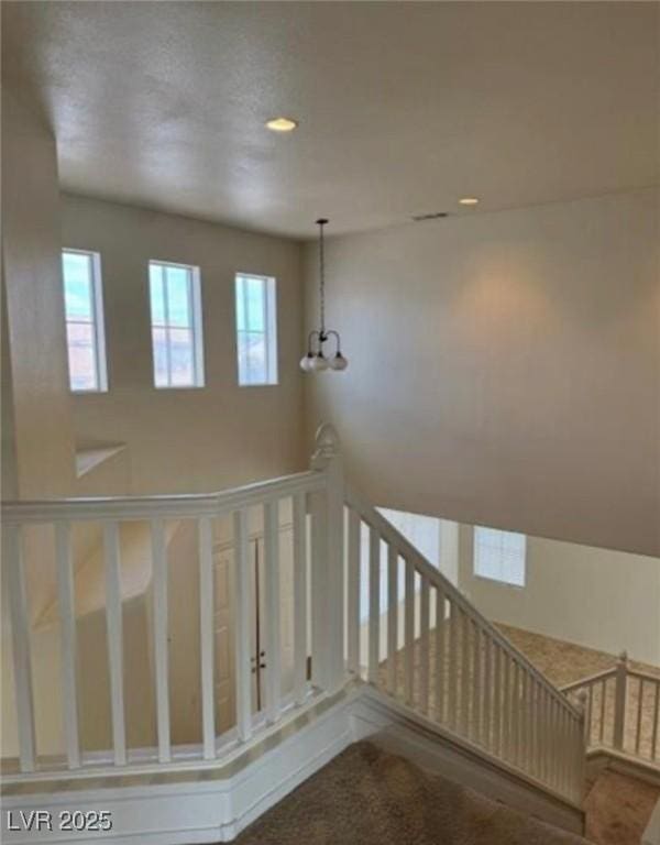 1003 Dover Glen Dr, North Las Vegas, NV 89031 - staircase with recessed lighting and a notable chandelier