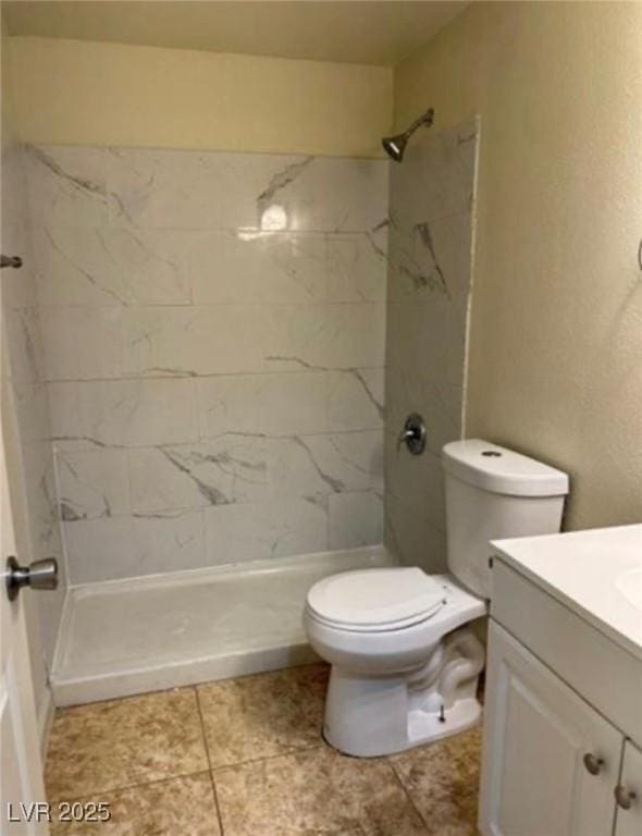 1003 Dover Glen Dr, North Las Vegas, NV 89031 - bathroom with toilet, vanity, and a stall shower
