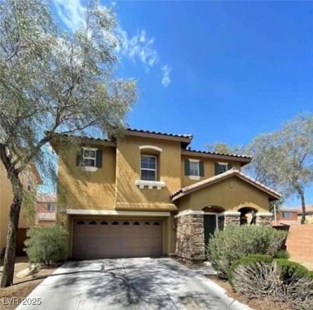 8768 Charm Canyon Ave, Las Vegas, NV 89178 - mediterranean / spanish-style home featuring a tiled roof, stone siding, concrete driveway, an attached garage, and stucco siding