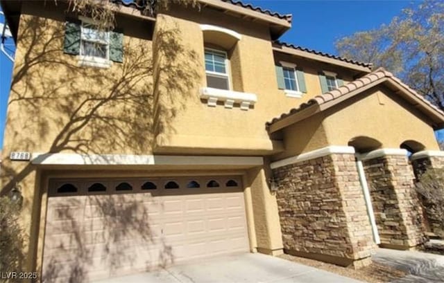 8768 Charm Canyon Ave, Las Vegas, NV 89178 - view of front of property with a garage, a tile roof, stone siding, and stucco siding