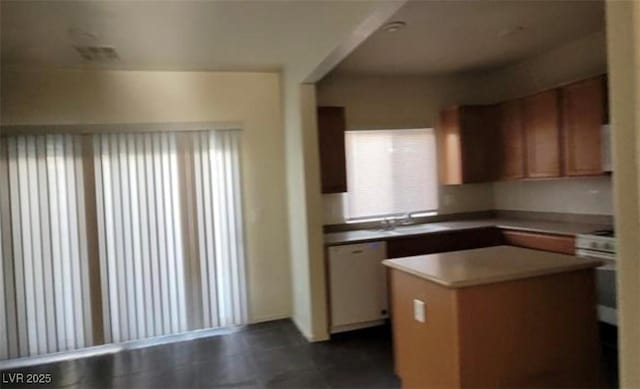 8768 Charm Canyon Ave, Las Vegas, NV 89178 - kitchen featuring a center island, white dishwasher, wall oven, and a sink