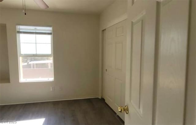 8768 Charm Canyon Ave, Las Vegas, NV 89178 - unfurnished bedroom with dark wood-type flooring and a closet