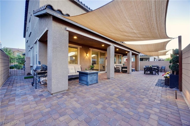 view of patio / terrace featuring an outdoor hangout area, area for grilling, outdoor dining area, and fence