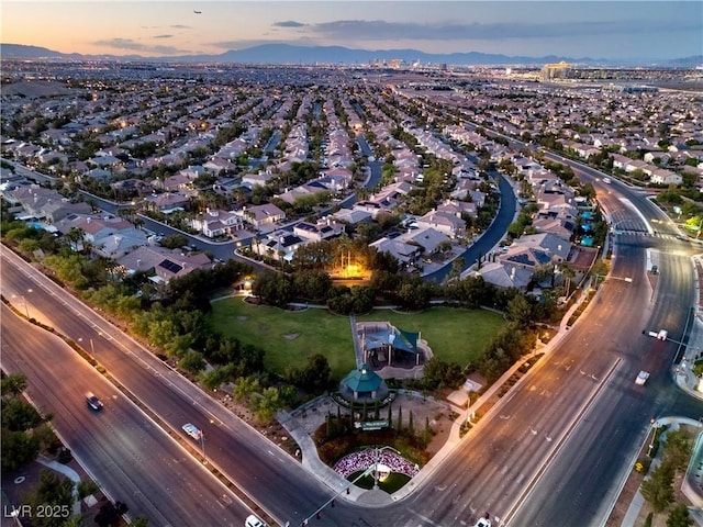 birds eye view of property with a residential view and a mountain view