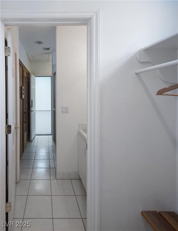 hallway with light tile patterned floors