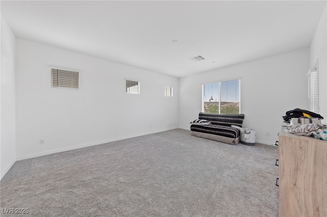 31 Strada Loreto, Henderson, NV 89011 - living area with visible vents, carpet flooring, and baseboards