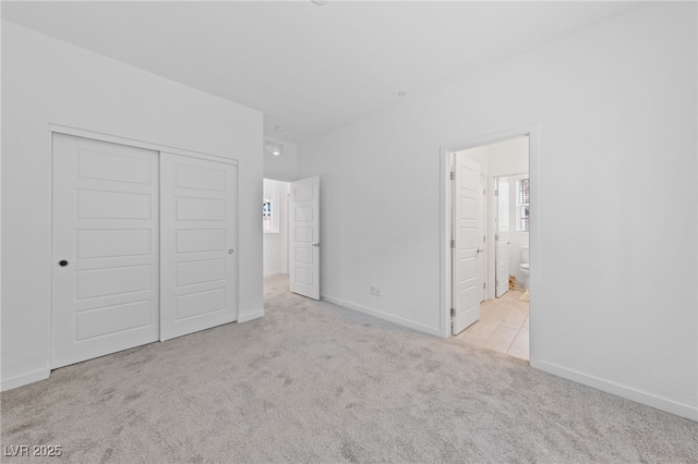 31 Strada Loreto, Henderson, NV 89011 - unfurnished bedroom with a closet, multiple windows, ensuite bathroom, and carpet