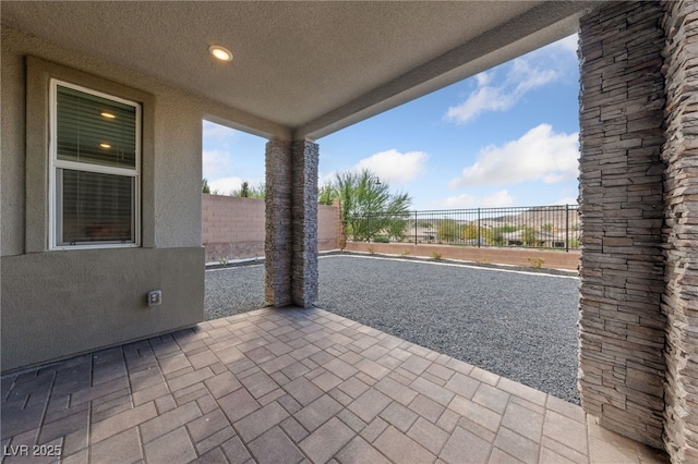 31 Strada Loreto, Henderson, NV 89011 - view of patio / terrace featuring fence