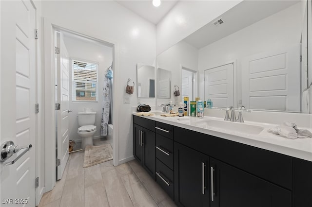 31 Strada Loreto, Henderson, NV 89011 - bathroom featuring shower / bath combo, a sink, double vanity, toilet, and visible vents