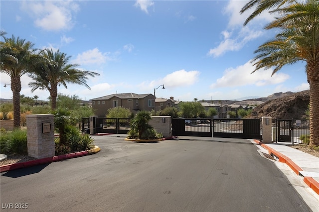 31 Strada Loreto, Henderson, NV 89011 - view of street with curbs, a gate, a residential view, a gated entry, and sidewalks