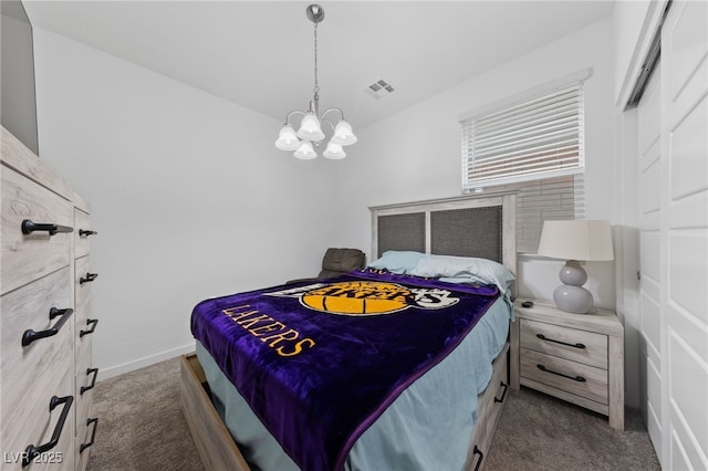 31 Strada Loreto, Henderson, NV 89011 - bedroom featuring dark carpet, baseboards, a notable chandelier, and visible vents