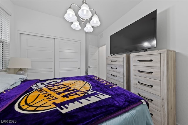 31 Strada Loreto, Henderson, NV 89011 - bedroom featuring visible vents, a closet, and an inviting chandelier