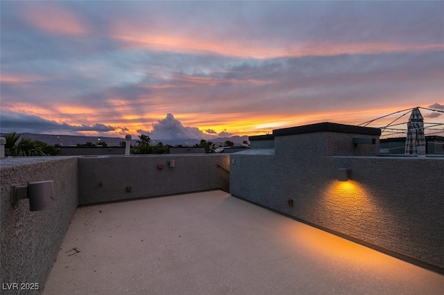 patio terrace at dusk with a balcony
