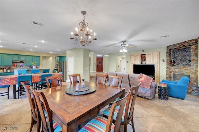 112 Kava Kava St, Henderson, NV 89015 - dining room with light tile patterned flooring, visible vents, and ceiling fan with notable chandelier