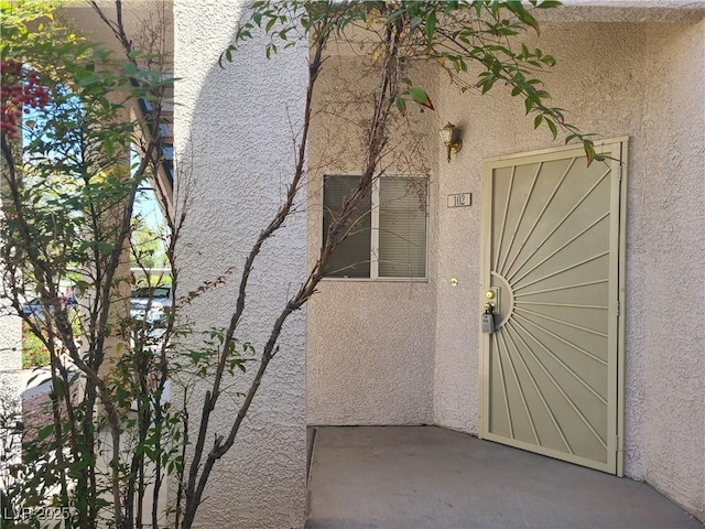 2117 Echo Bay St Unit 102, Las Vegas, NV 89128 - view of exterior entry with stucco siding