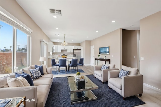 5286 Monterey Park Cir, Las Vegas, NV 89146 - living area with wood finished floors, baseboards, and recessed lighting