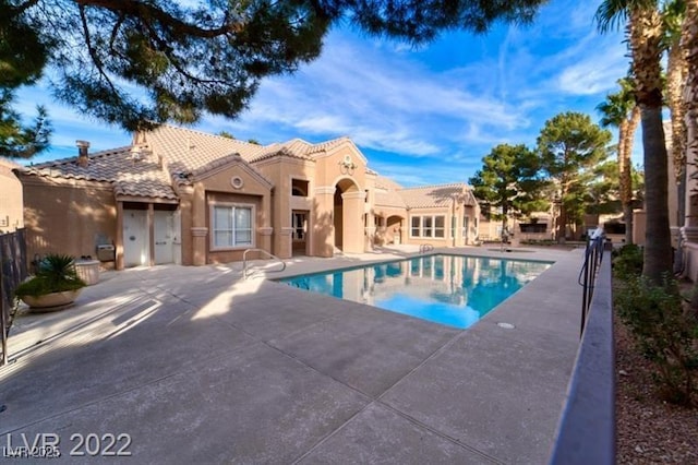 view of pool featuring a fenced in pool and a patio area