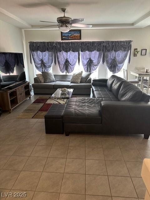 living room featuring tile patterned floors and a ceiling fan