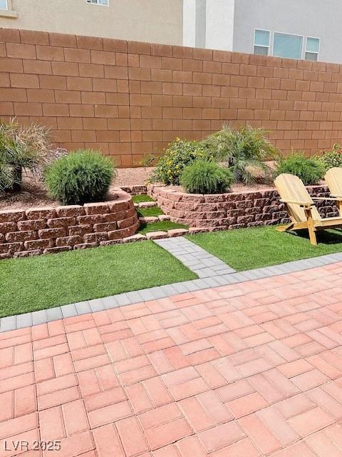 view of yard with a patio and fence
