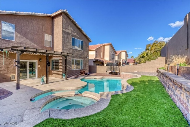 view of pool with a pergola, a patio area, a lawn, a fenced backyard, and a pool with connected hot tub