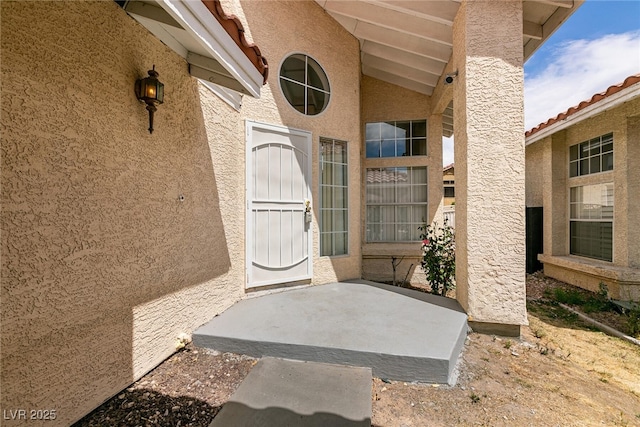 7620 Tortola Bay Ln, Las Vegas, NV 89128 - doorway to property featuring stucco siding