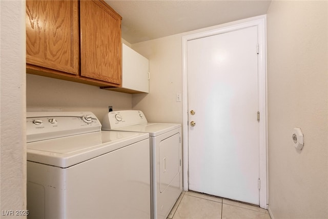 7620 Tortola Bay Ln, Las Vegas, NV 89128 - clothes washing area with light tile patterned flooring, washer and dryer, cabinet space, and baseboards