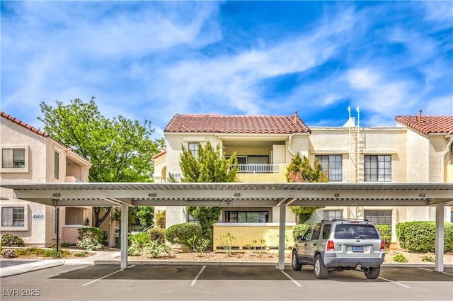 view of building exterior with covered parking