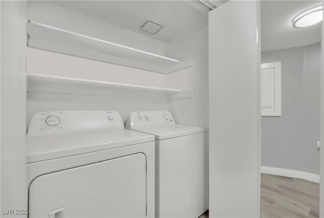 2080 Karen Ave Unit 1, Las Vegas, NV 89169 - laundry area with washing machine and dryer, baseboards, and light wood-style floors