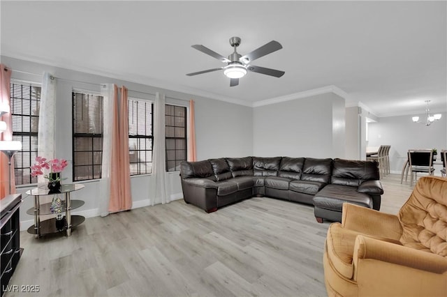 2080 Karen Ave Unit 1, Las Vegas, NV 89169 - living room with light wood finished floors, crown molding, ceiling fan, a chandelier, and baseboards
